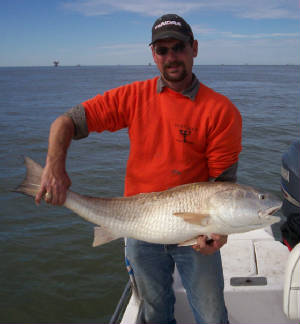 Captain Shawn Holding a Large Redfish or Bull Redfish